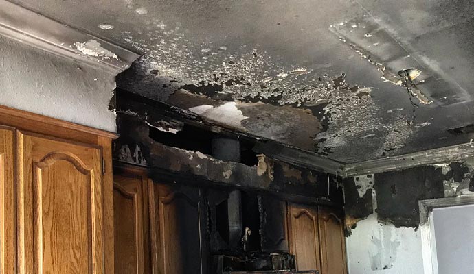cleaning smoke damaged ceiling with equipment