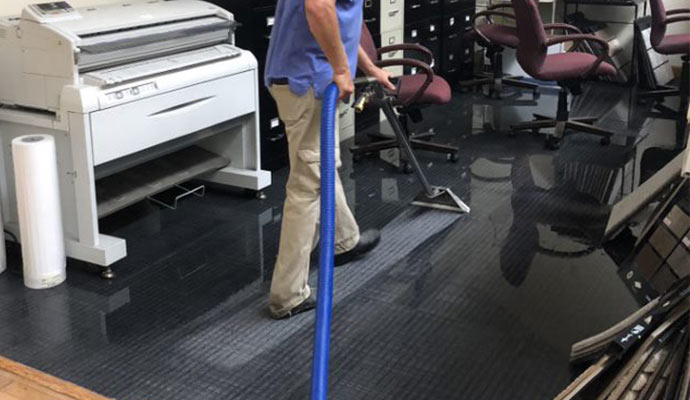 Flood damaged carpet water extracting
